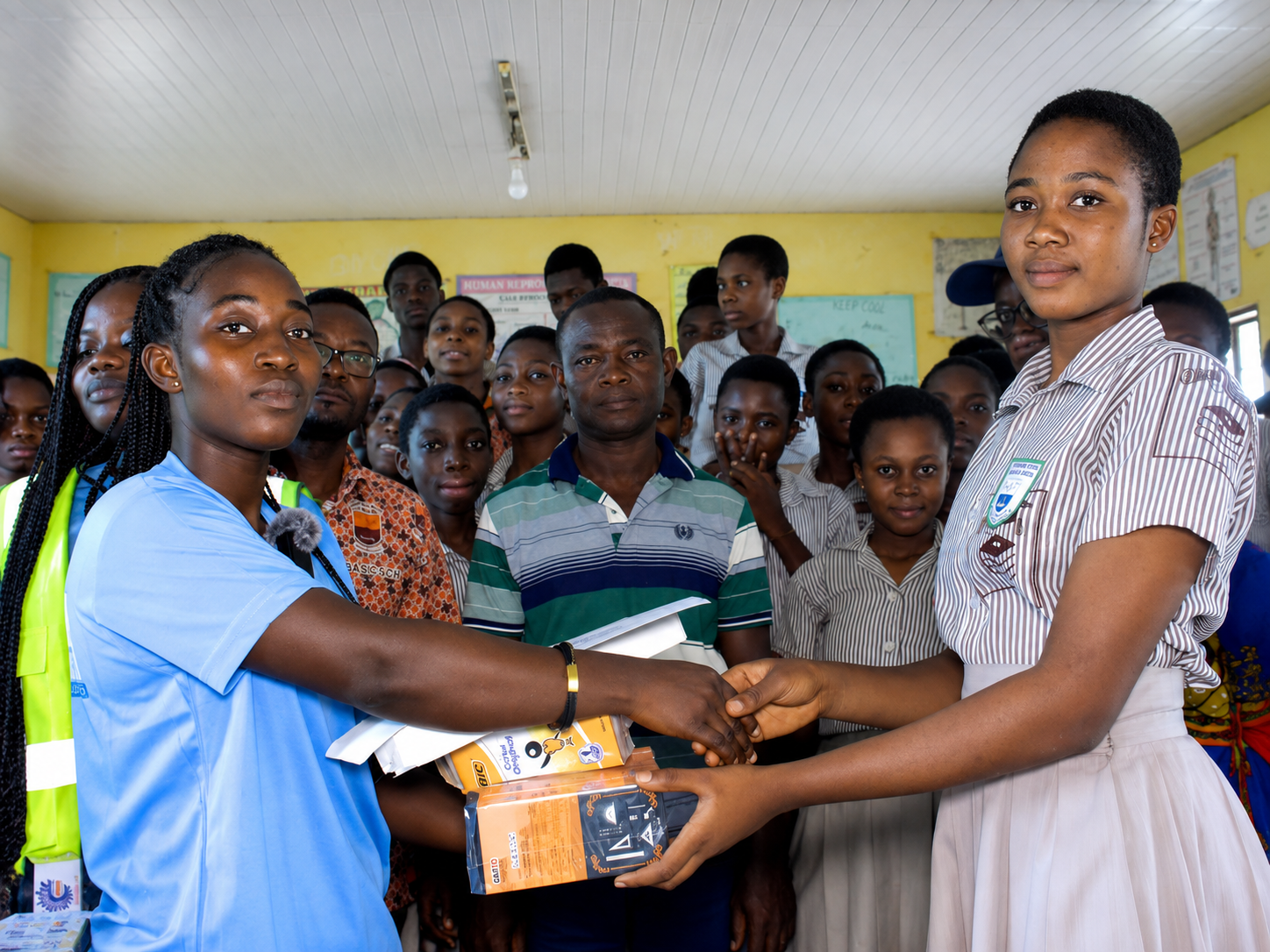 Students receiving learning materials from the Foundation
